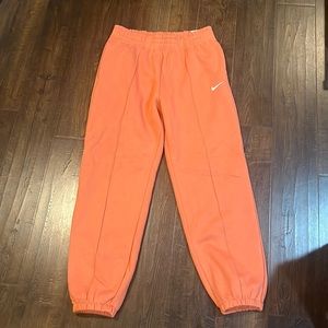 Nike sweatpants in Orange size M